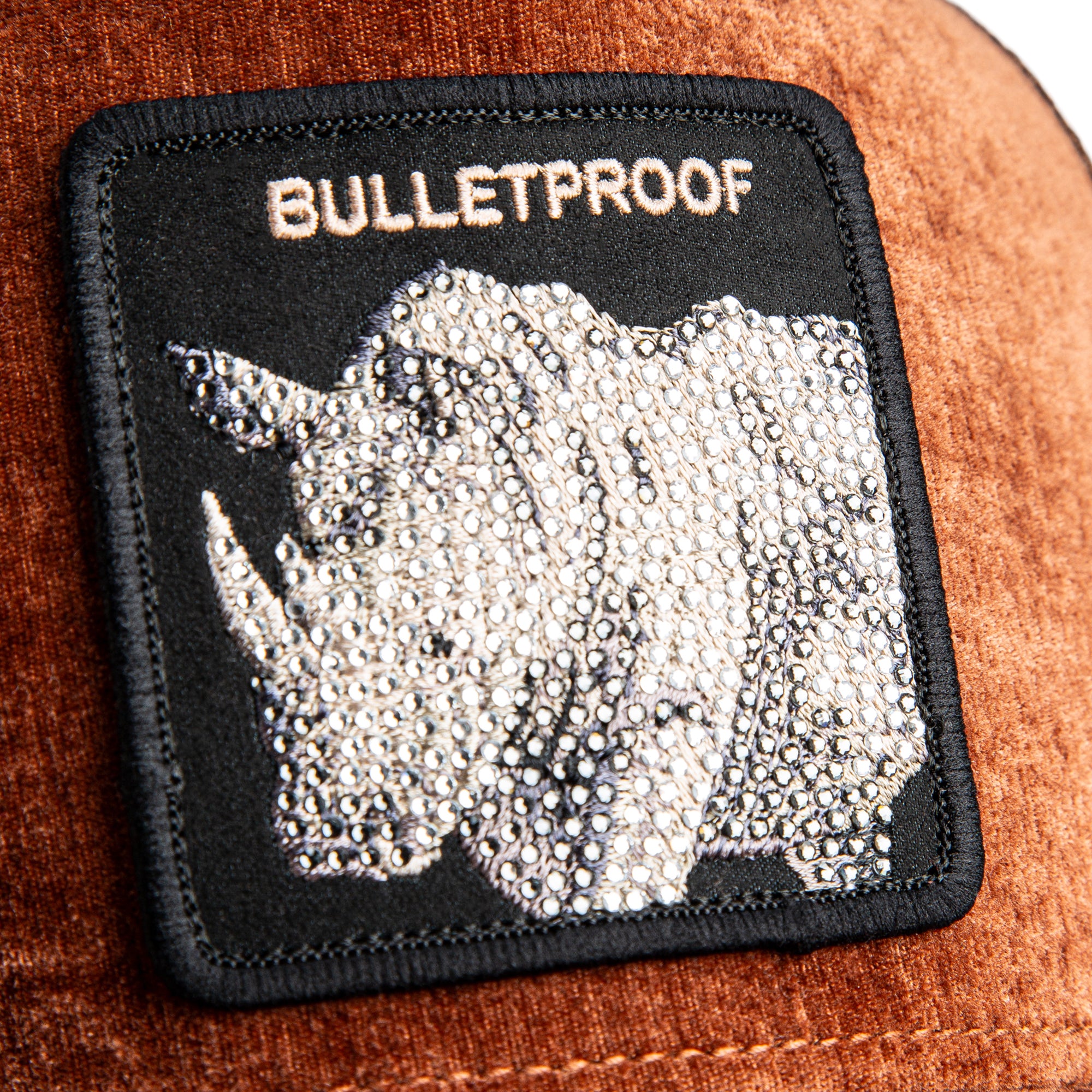 Patch with rhino design and 'BULLETPROOF' text on a textured surface