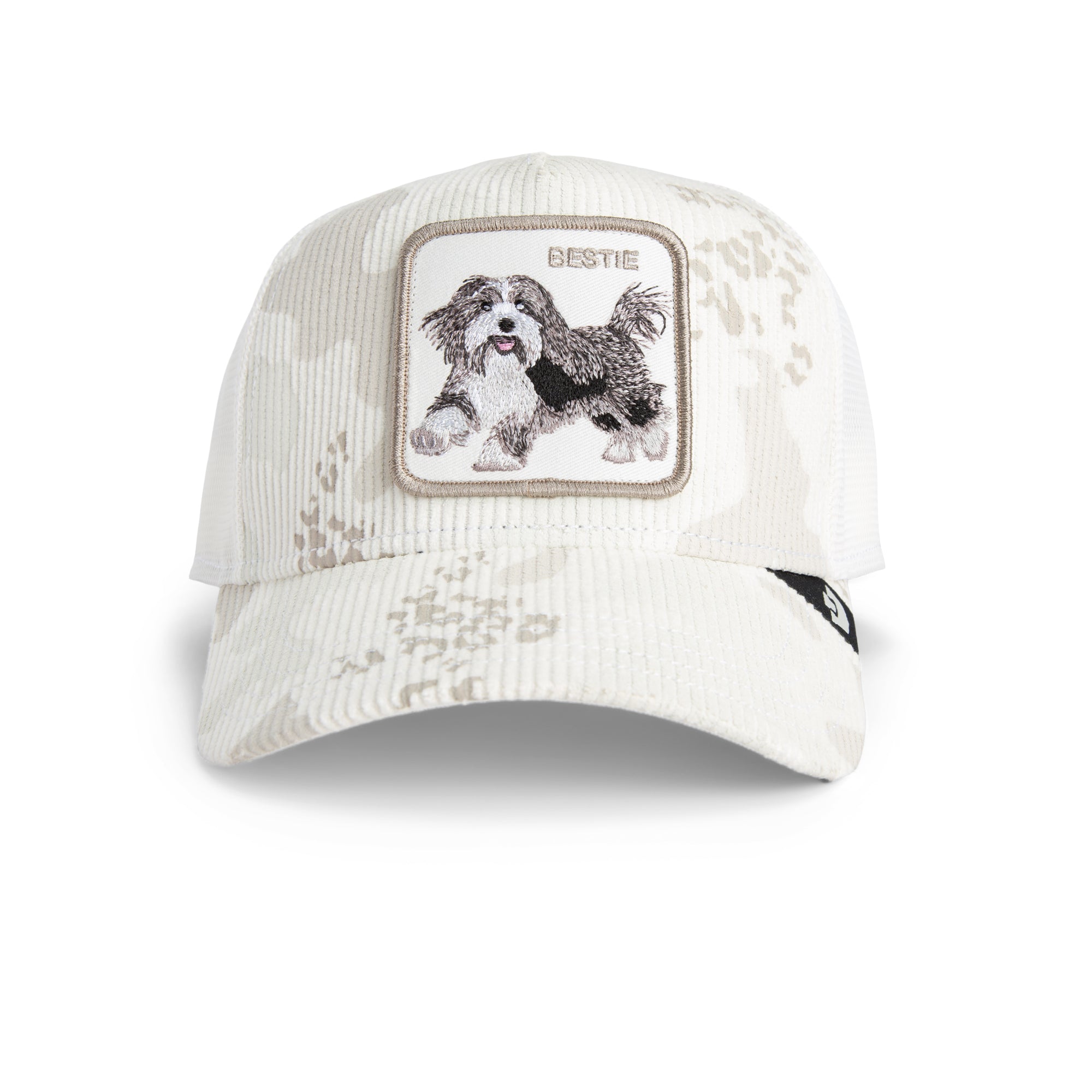 White cap with a dog patch and 'Bestie' text on a white background