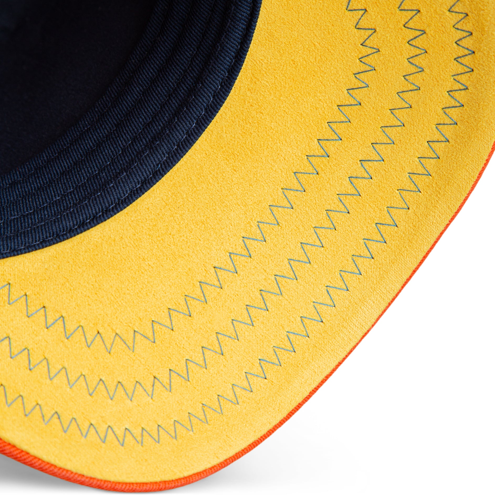 Beige, blue, and orange Goorin Bros trucker hat with corduroy front featuring embroidered squirrel patch labeled NUTS on front panel