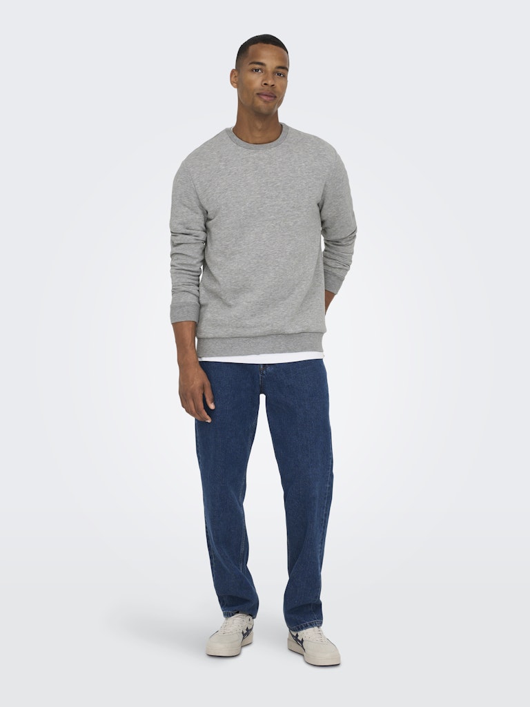 Man wearing a gray sweater and blue jeans on a white background By Only & Sons