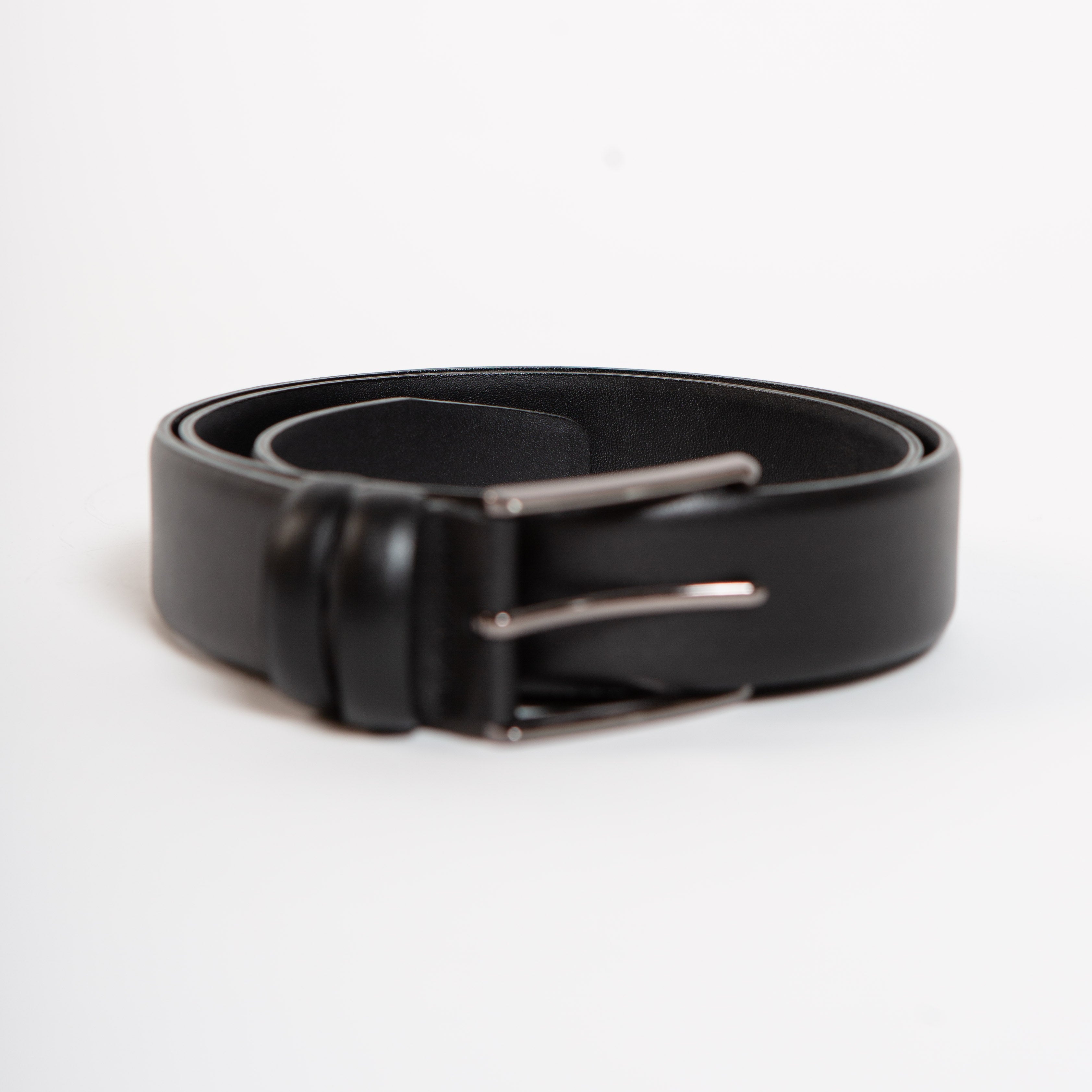 slim black leather belt with silver buckle
