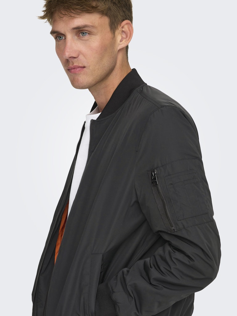 ONLY & SONS black bomber jacket — classic design with orange inner lining.