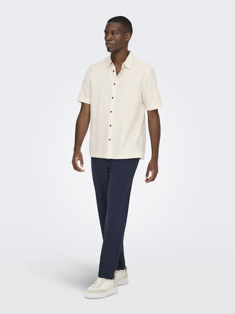wilson white textured cotton shirt angled view model hand in pocket