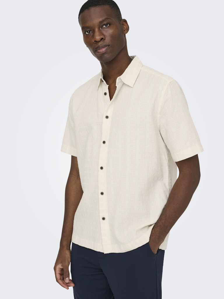 wilson white short sleeve textured cotton shirt front view model navy trousers