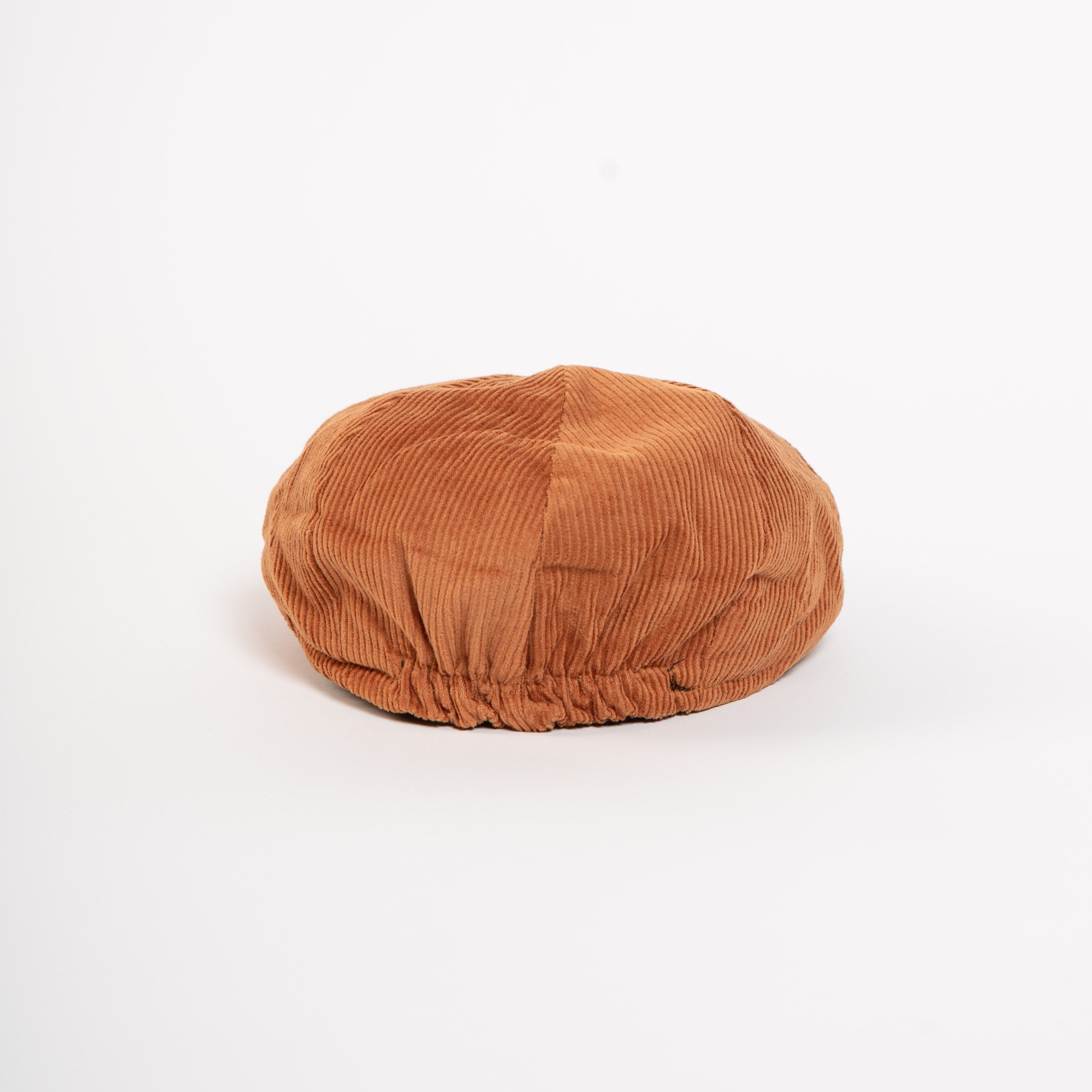 rust corduroy newsboy cap front view