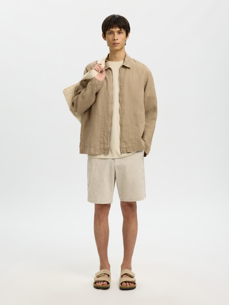 neutral linen overshirt summer outfit with shorts