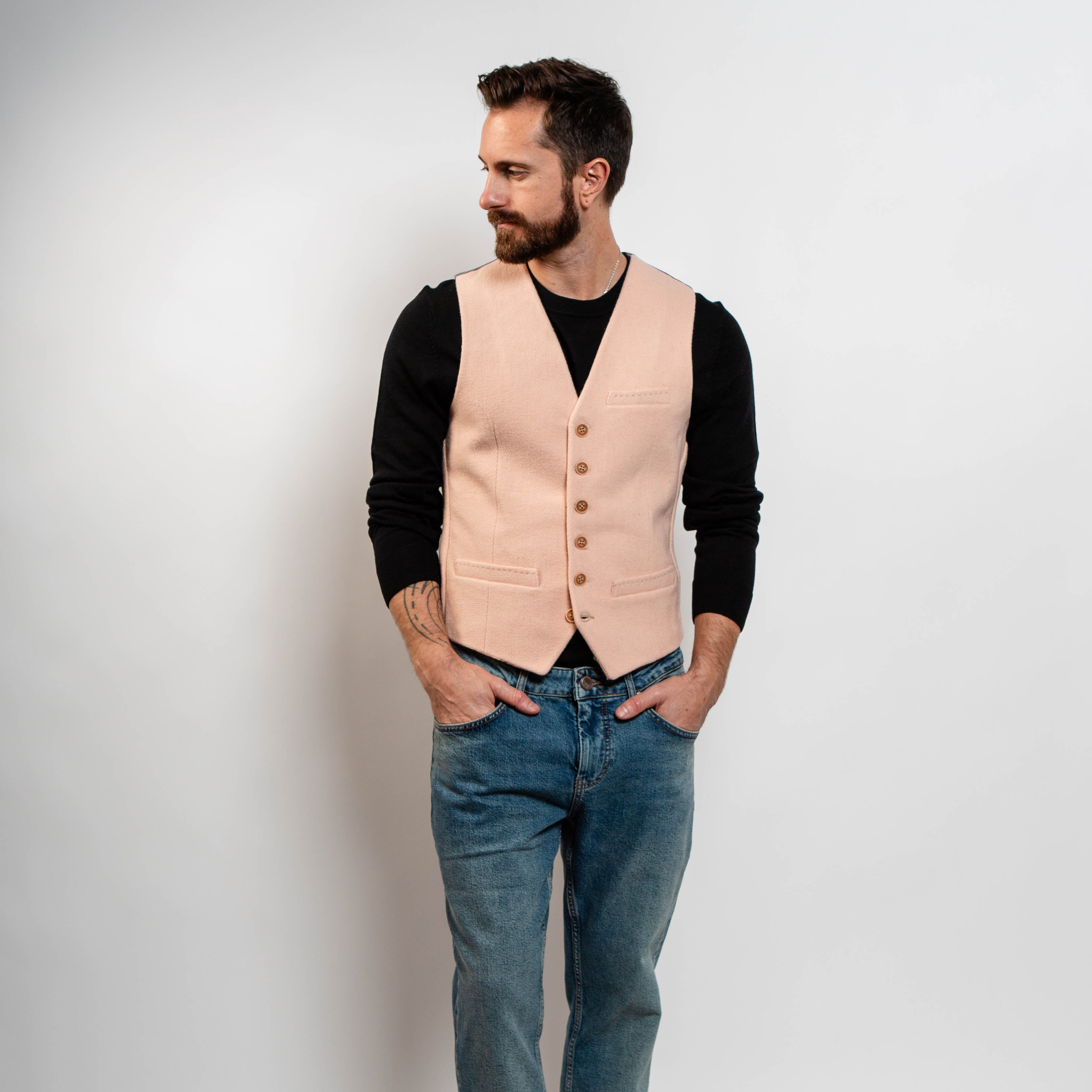 Blush pink waistcoat styled with black sweater