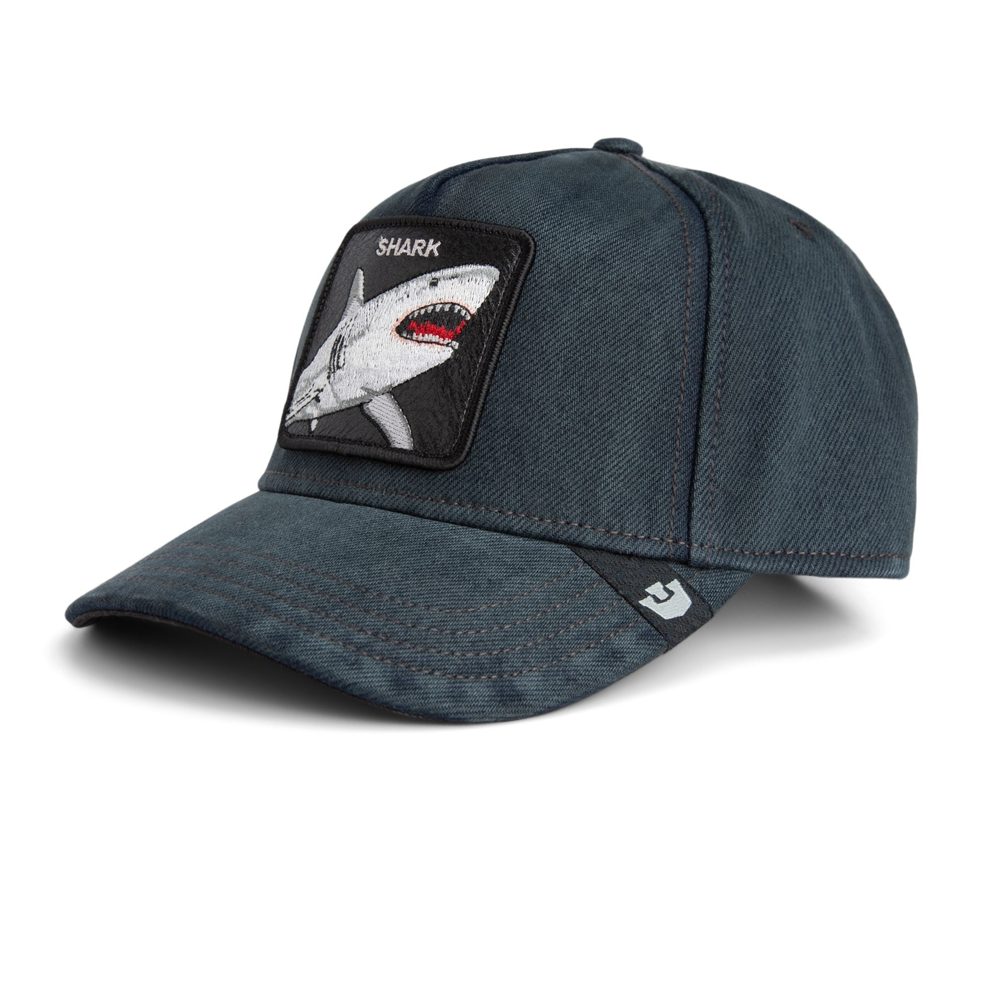 Navy blue Goorin Bros trucker hat featuring embroidered shark patch labeled SHARK on front panel

