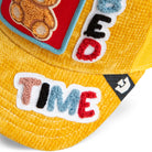 Yellow mesh back corduroy hat featuring teddy bear front patch