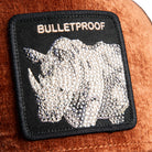 Patch with rhino design and 'BULLETPROOF' text on a textured surface