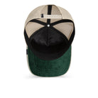 Cap with beige top, black sides, and green bottom on a white background