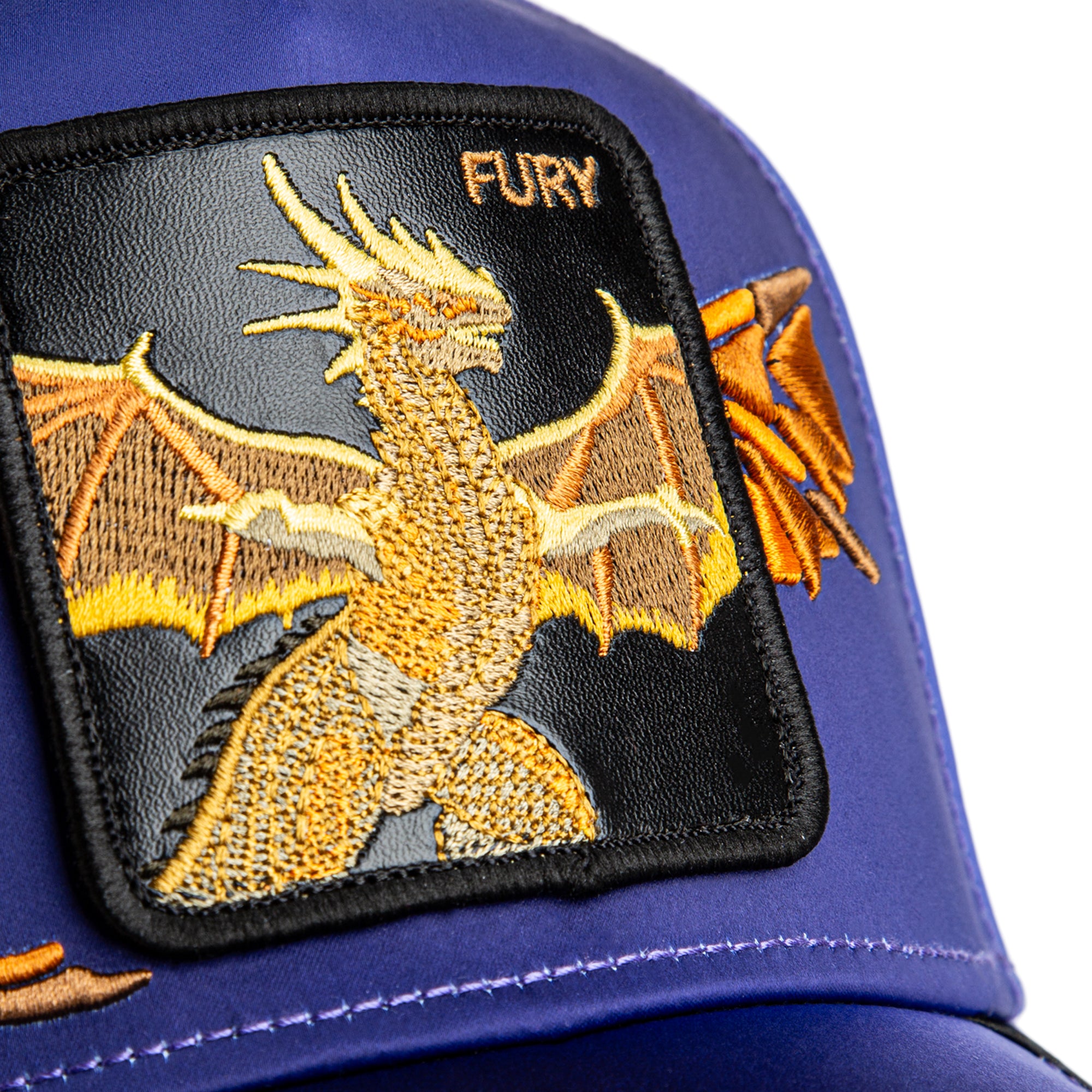 Dragon patch on a blue cap with 'FURY' branding