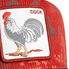 Red cap with a rooster patch and 'COCK' text on a white background