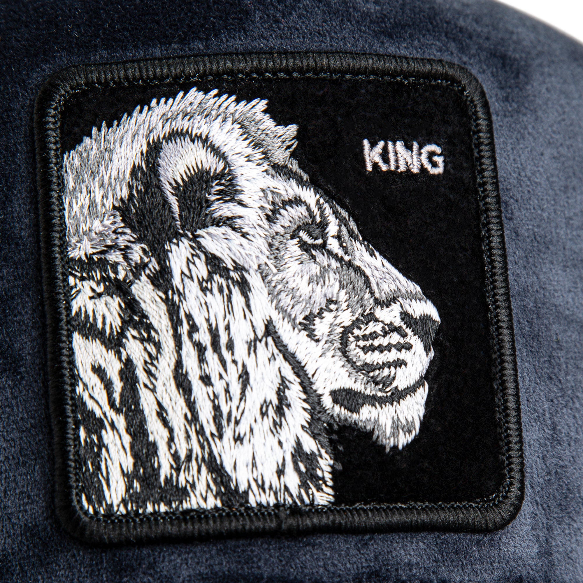 Goorin Bros King Lion Trucker Hat in navy with embroidered lion patch
