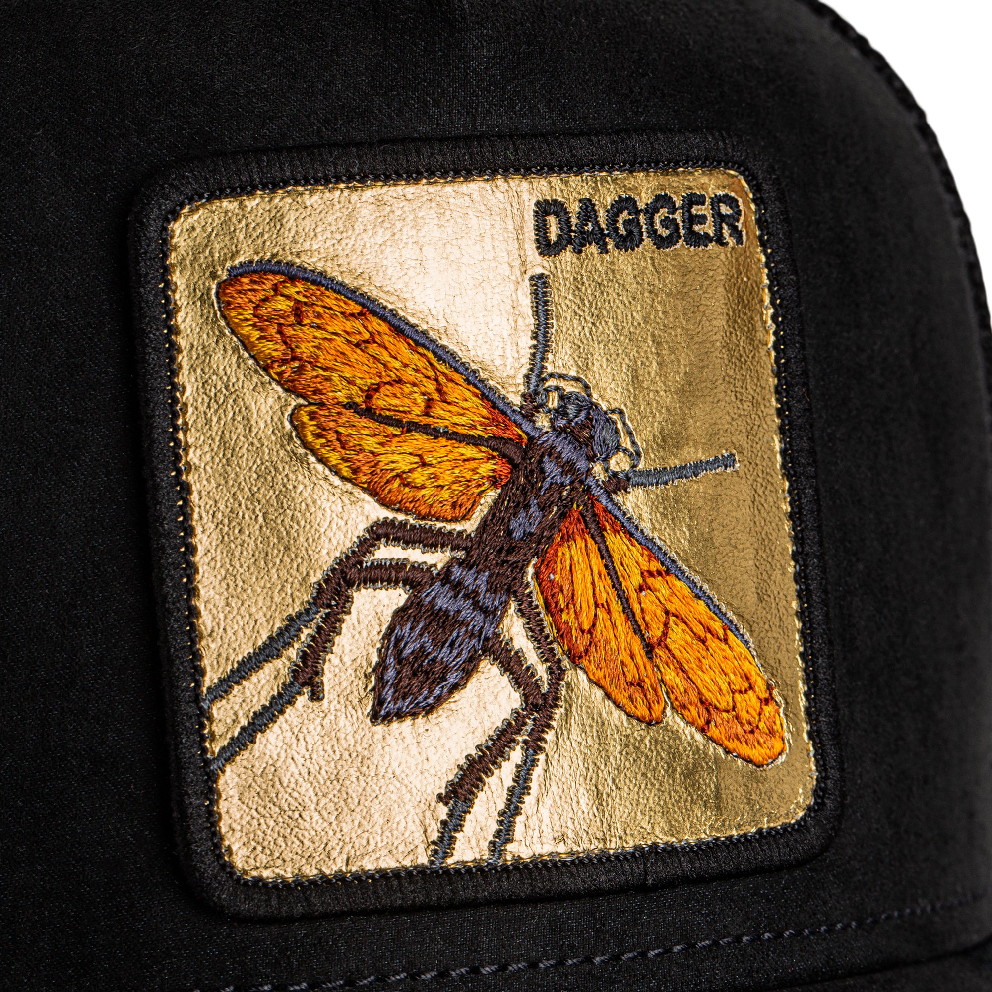 Patch of a dragonfly with 'DAGGER' text on a black background