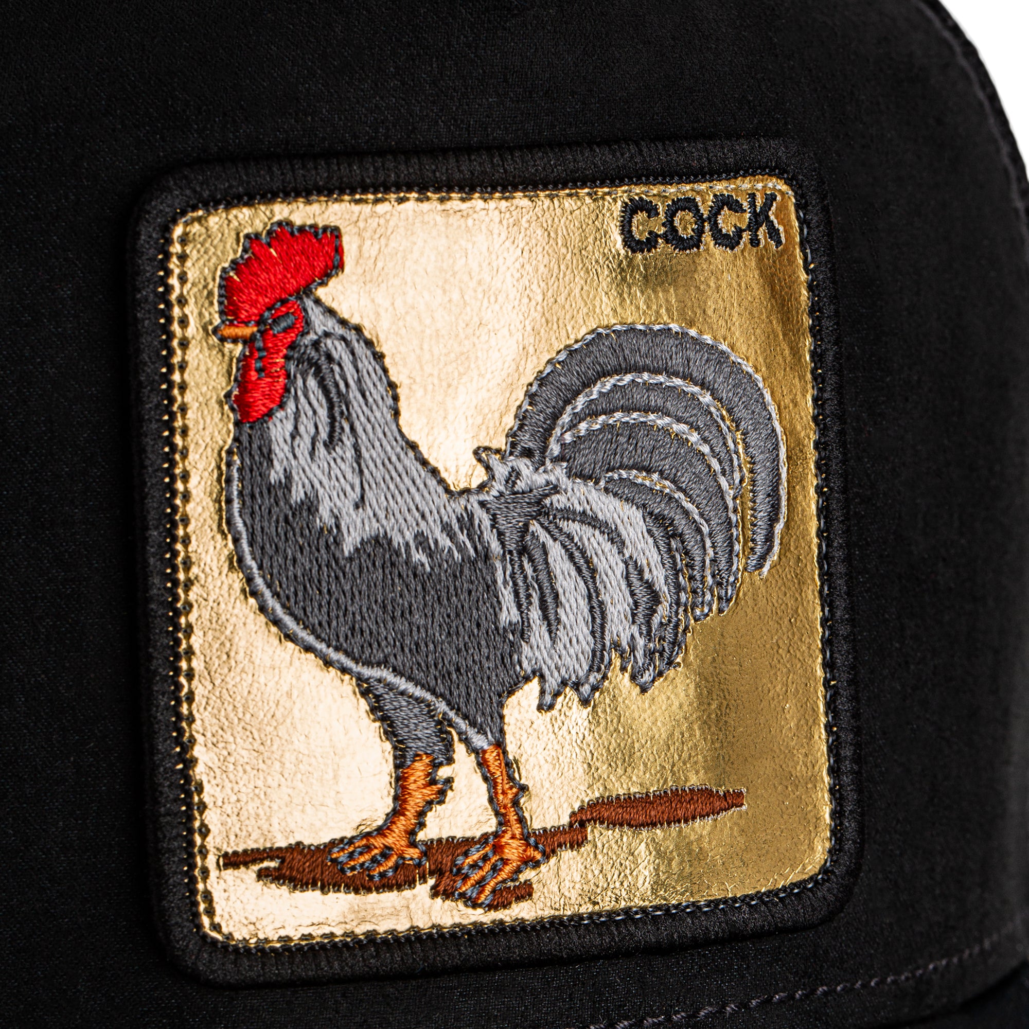 Embroidered patch of a rooster on a black background