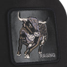Black Goorin Bros trucker hat with mesh back featuring embroidered bull patch labeled RAGING on front panel
