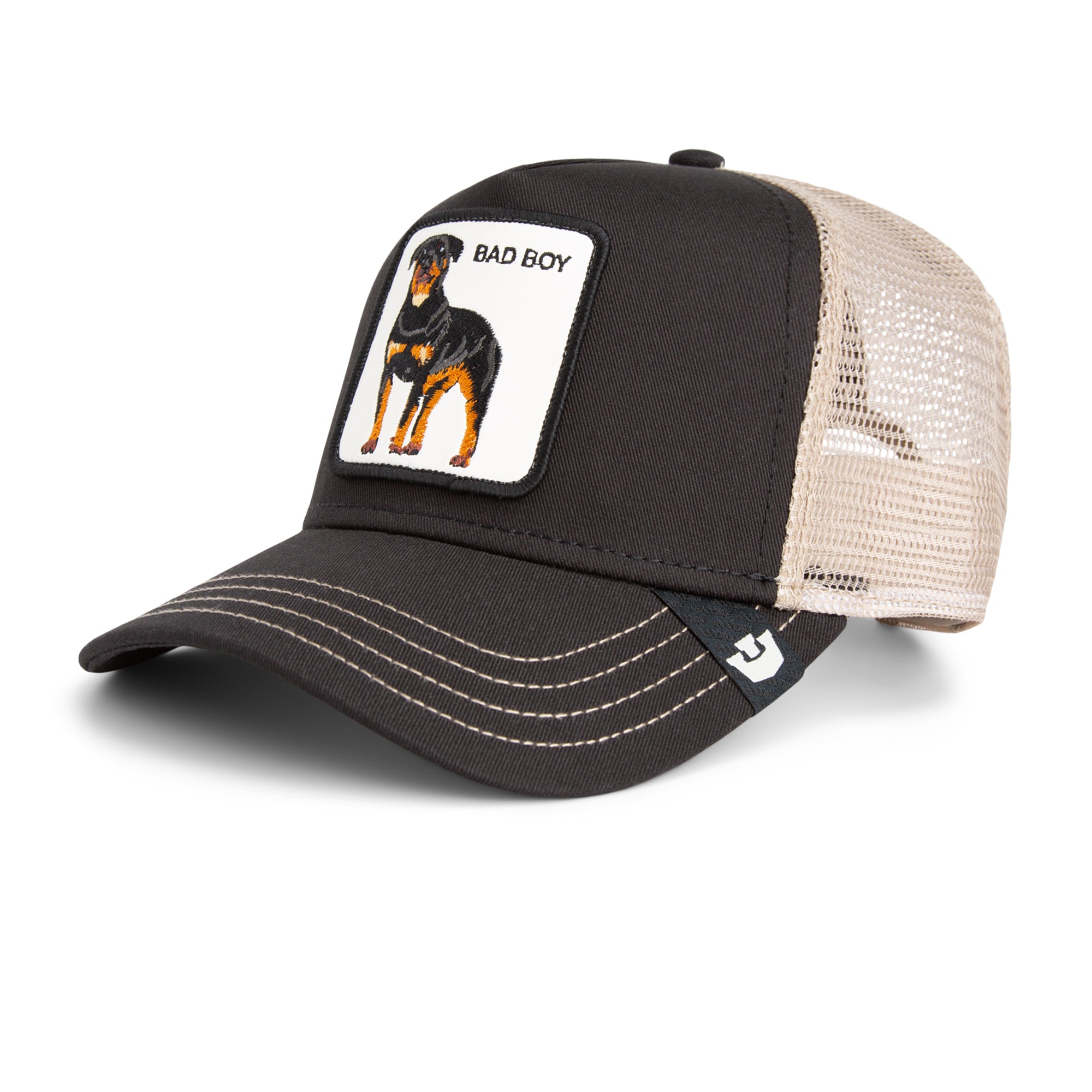 Black and beige Goorin Bros trucker hat with mesh back featuring embroidered Rottweiler patch labeled BAD BOY on front panel
