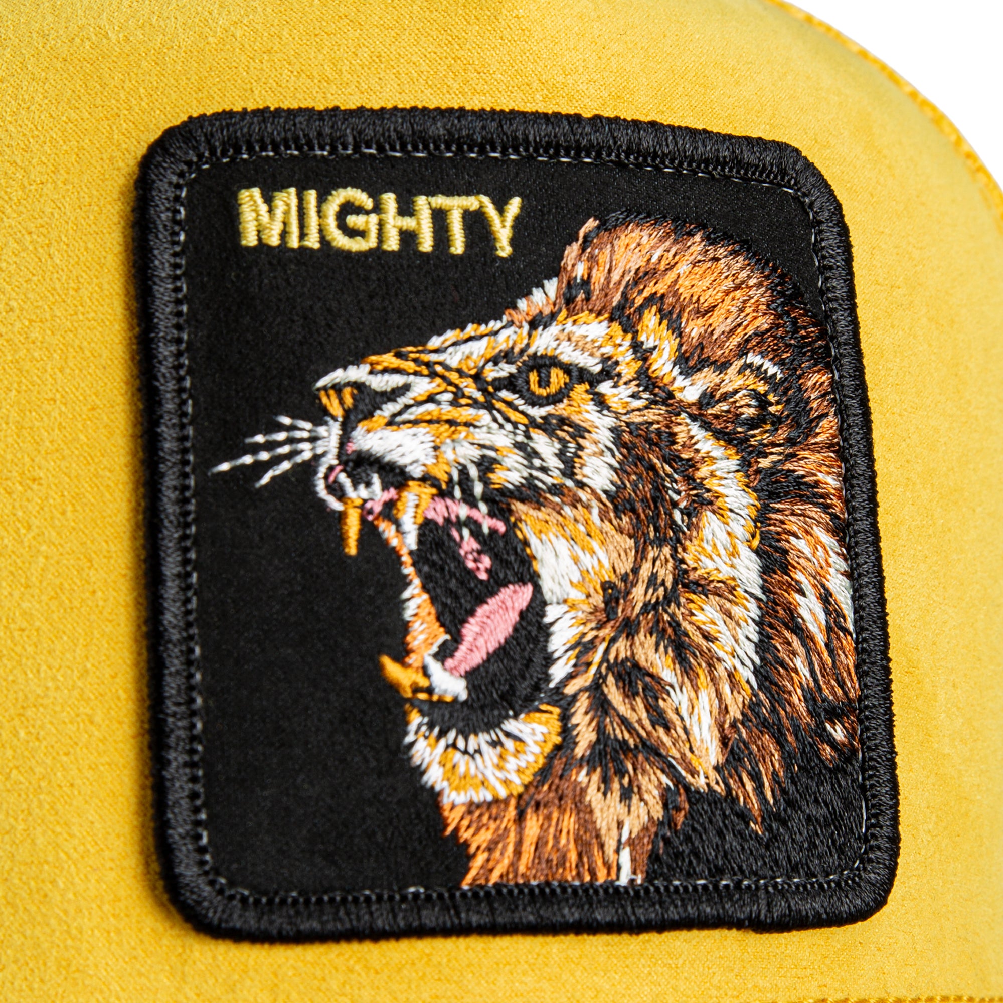 Yellow mesh back trucker hat with Mighty lion animal patch