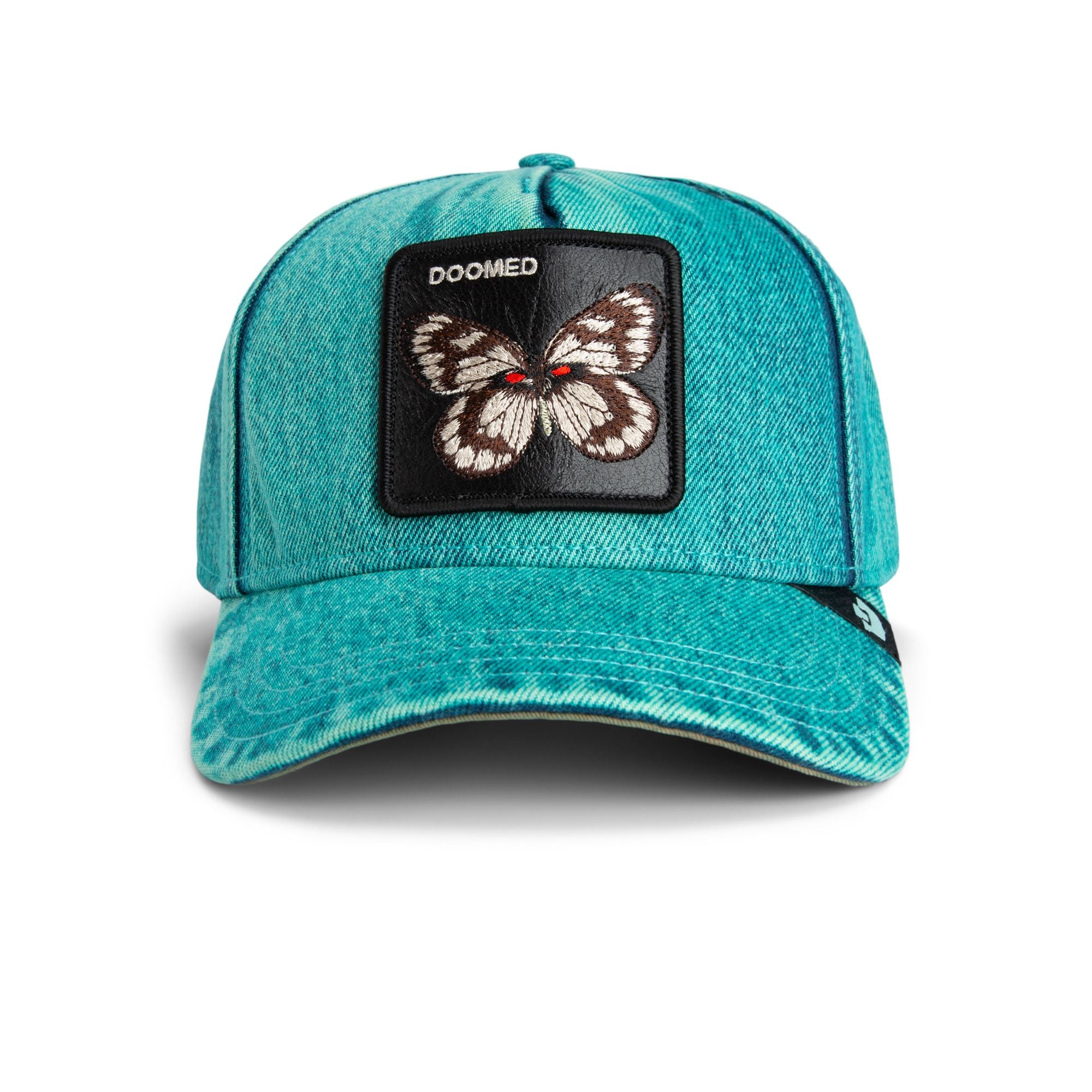 Goorin Bros Doomed Butterfly Trucker Hat in teal denim with embroidered butterfly patch
