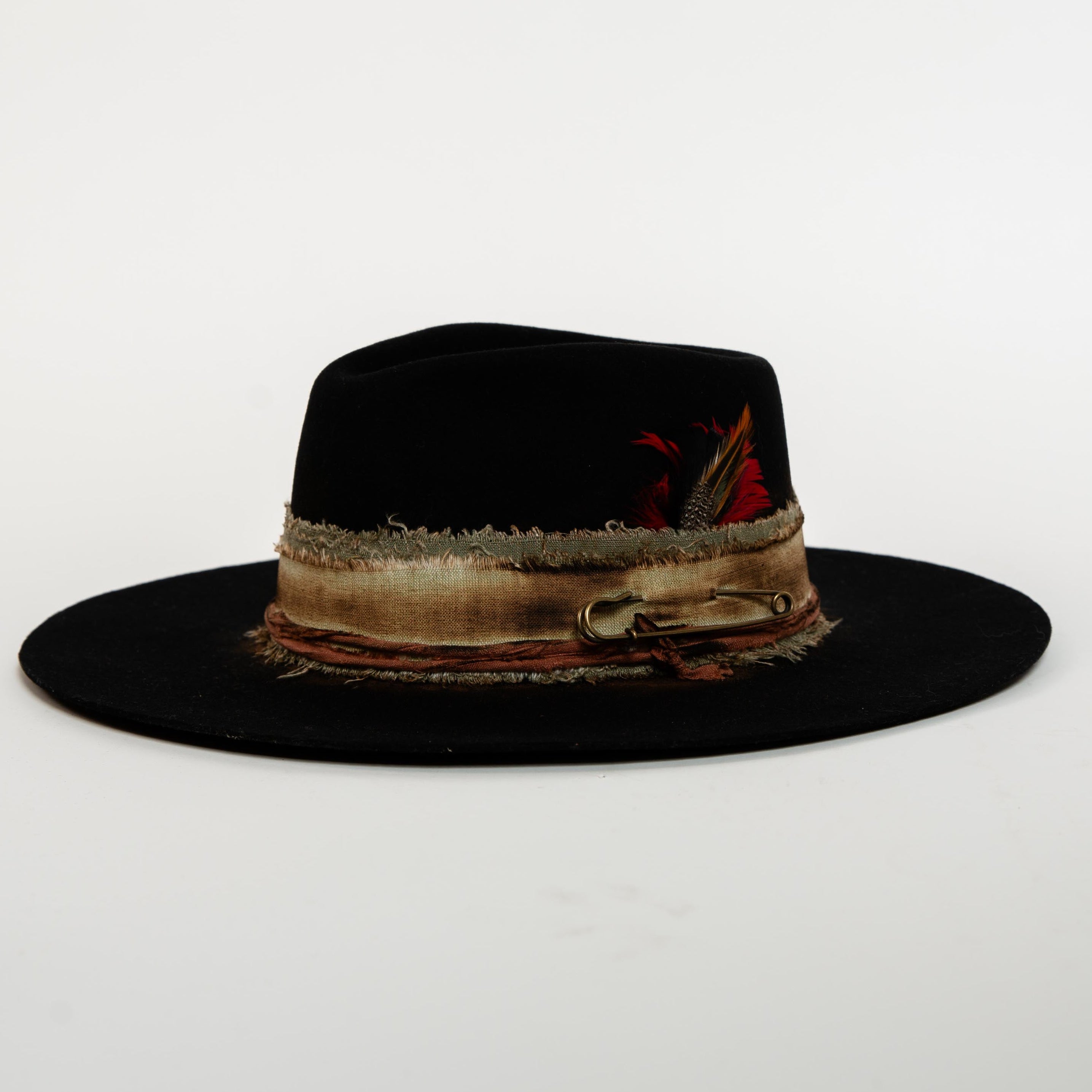 Black fedora hat with decorative band on a white background