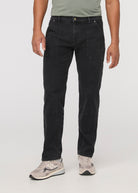 Person wearing black pants on a white background By Duer Jeans