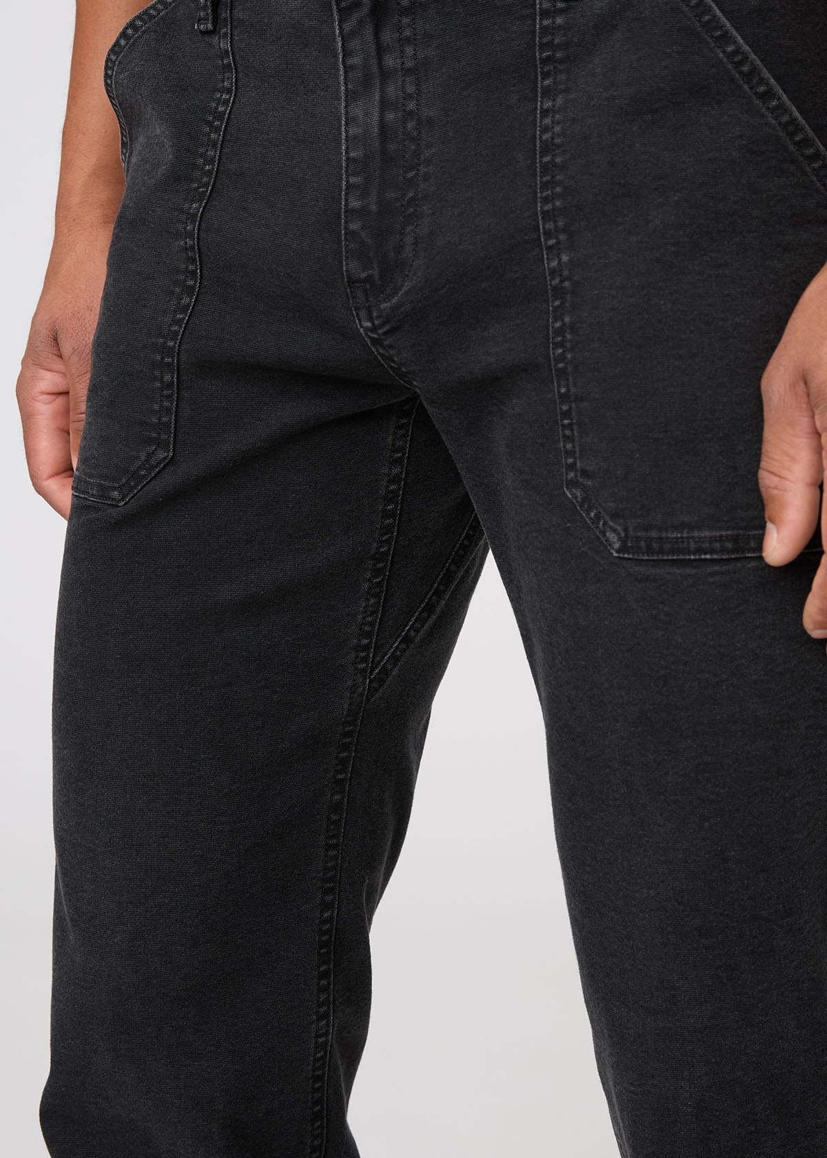 Close-up of black pants on a white background By Duer Jeans