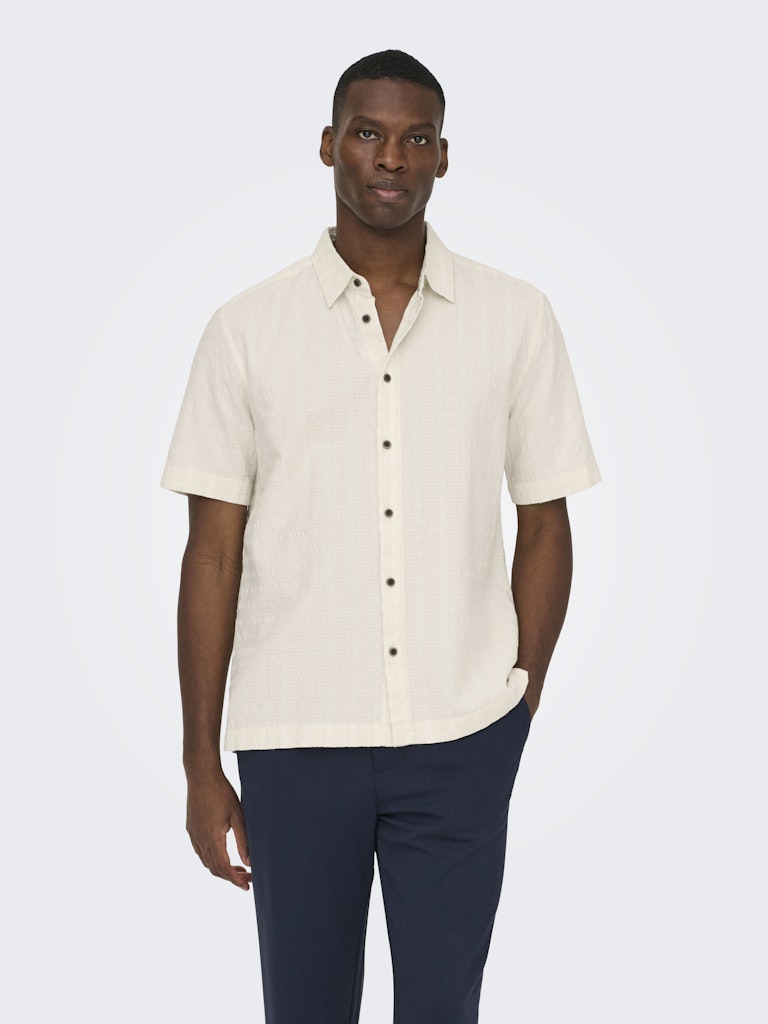 wilson white short sleeve cotton button up shirt close up texture detail