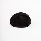 black corduroy paperboy hat front view