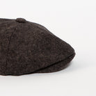 charcoal brown herringbone newsboy cap side angle