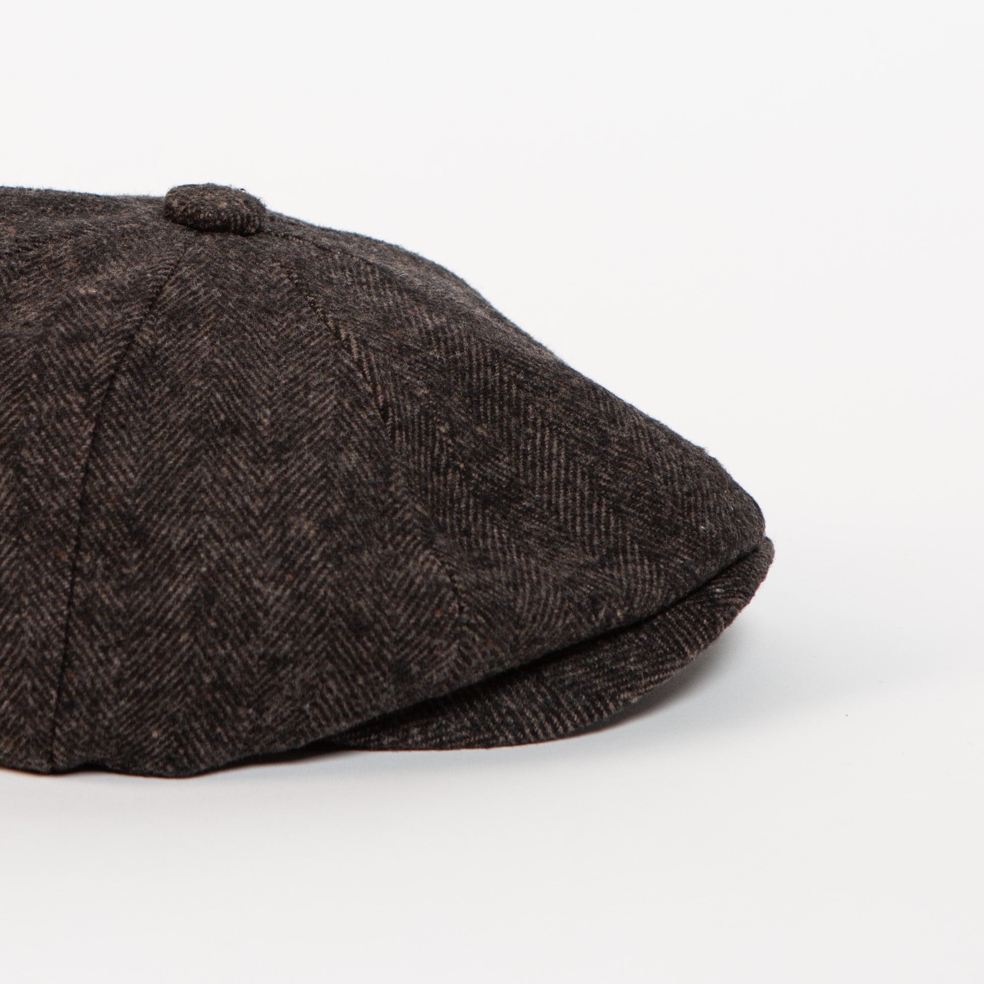 charcoal brown herringbone newsboy cap side angle