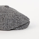 grey houndstooth newsboy cap side angle