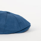 slate blue newsboy cap side angle