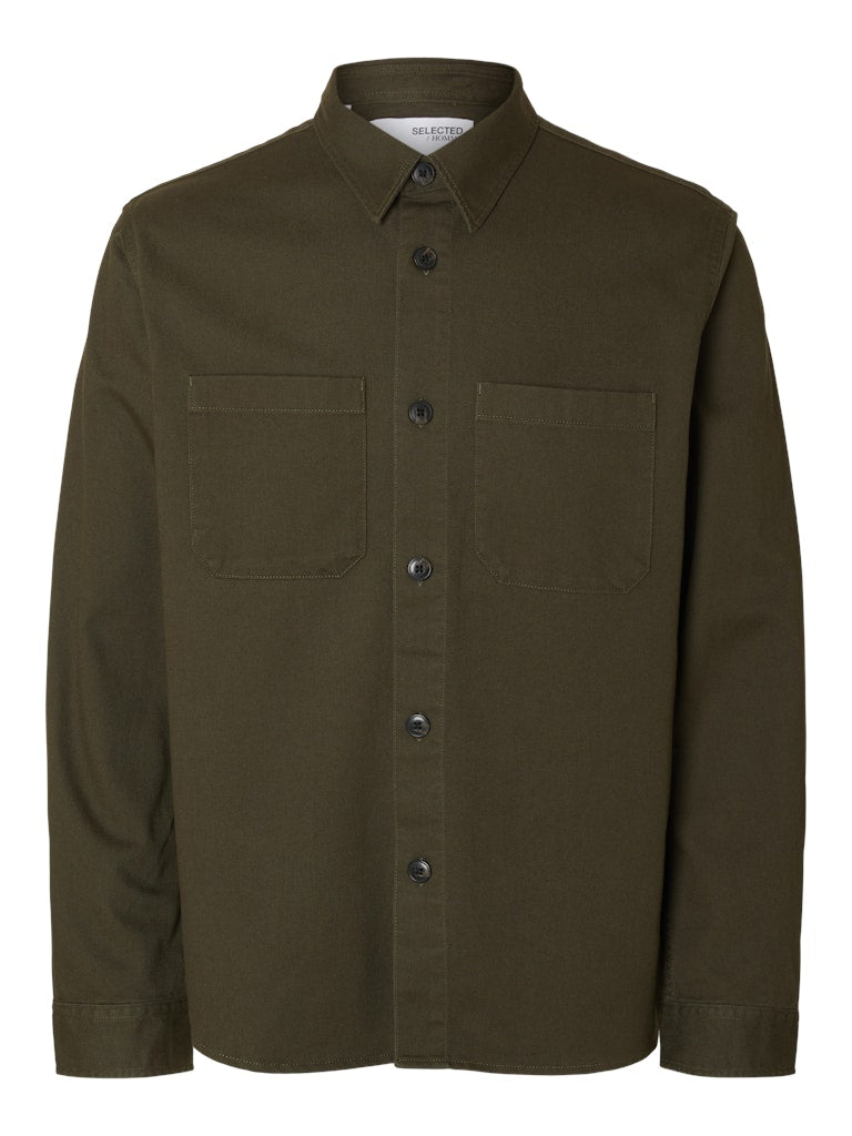 Male model wearing a Forest Green twill overshirt by SELECTED Homme, featuring button-up front, two chest pockets, and a relaxed minimalist fit.