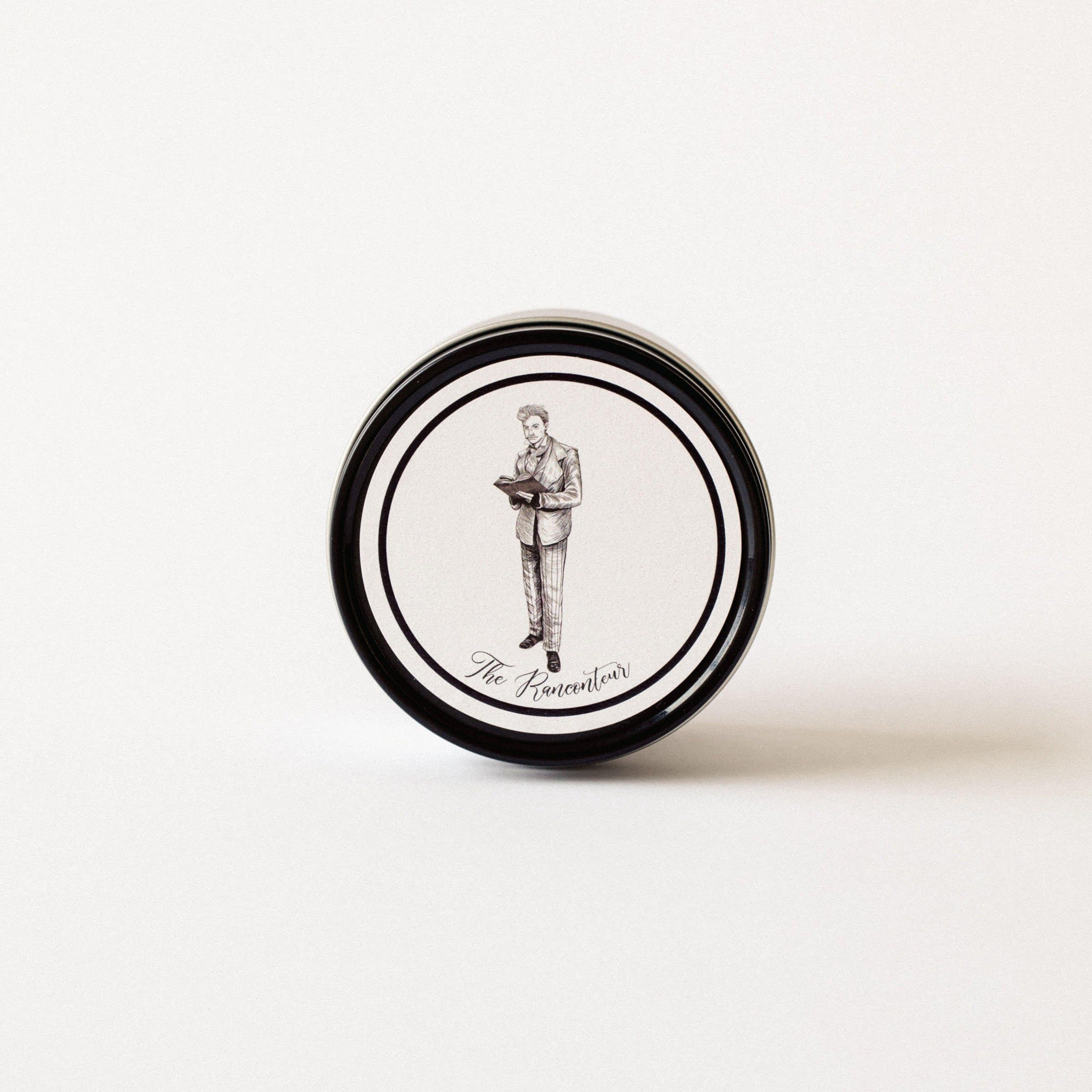 Hand poured luxury candle with illustrated lid in black metal tin