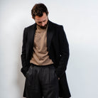 Midnight wool peacoat styled with beige turtleneck