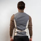 Neutral sand waistcoat styled with brown turtleneck