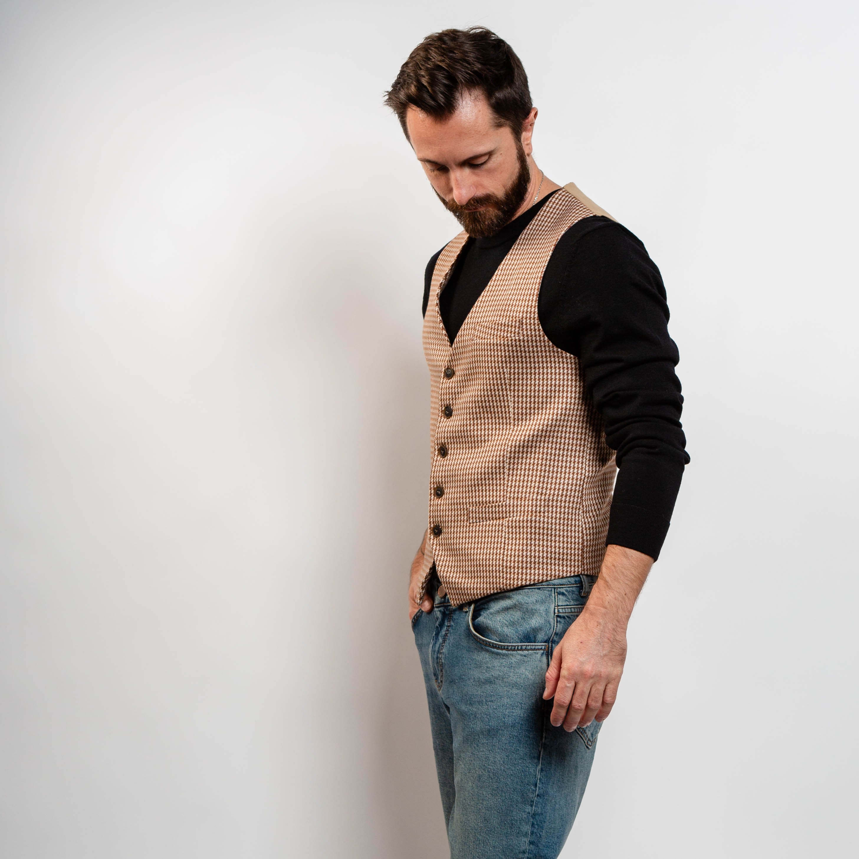 Brown patterned waistcoat styled with black sweater