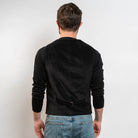 Black corduroy waistcoat styled with black knit