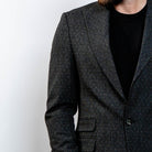 Modern charcoal blazer styled with jeans