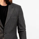 Modern charcoal blazer styled with jeans