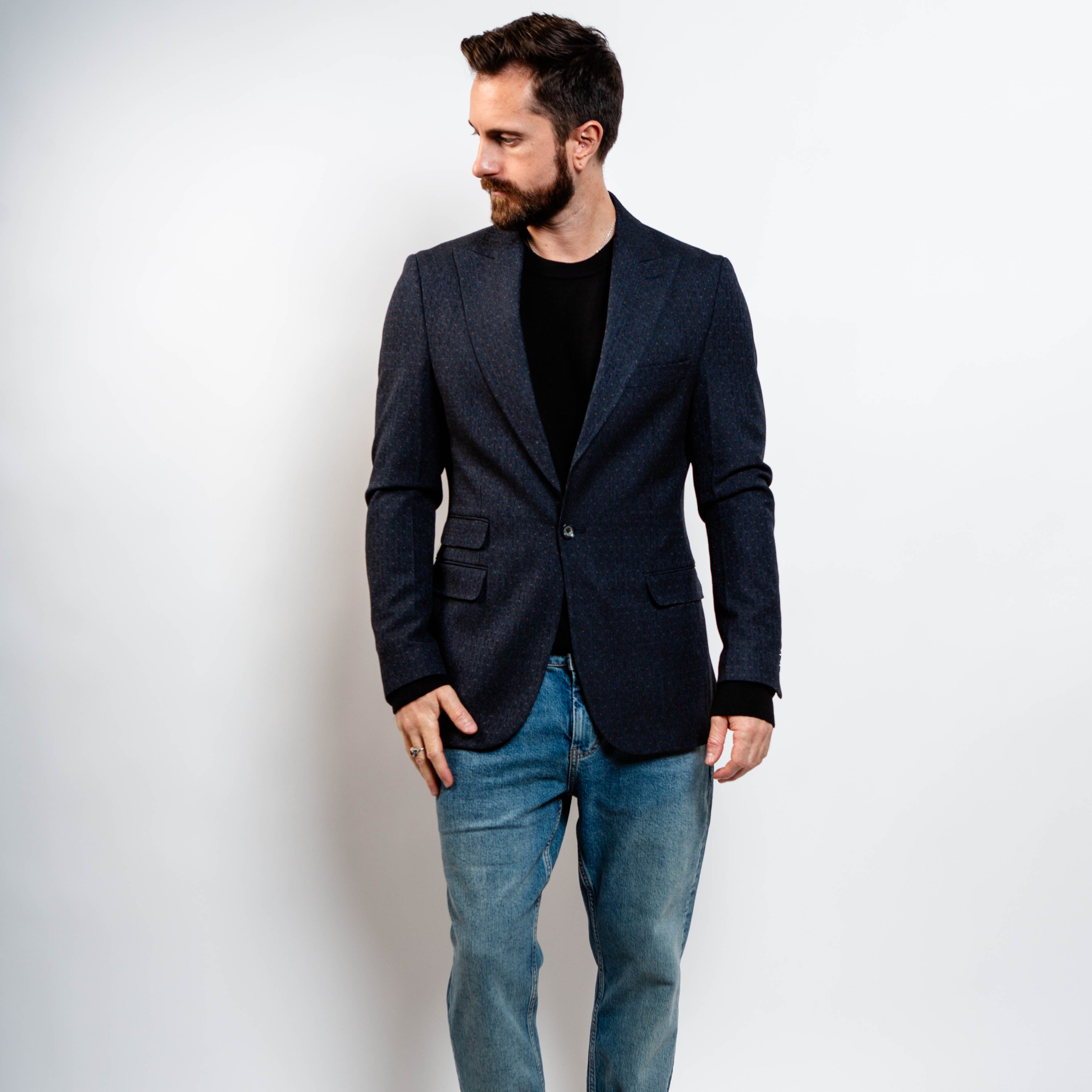 Modern navy blazer styled with jeans