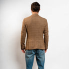 Classic camel blazer styled with jeans