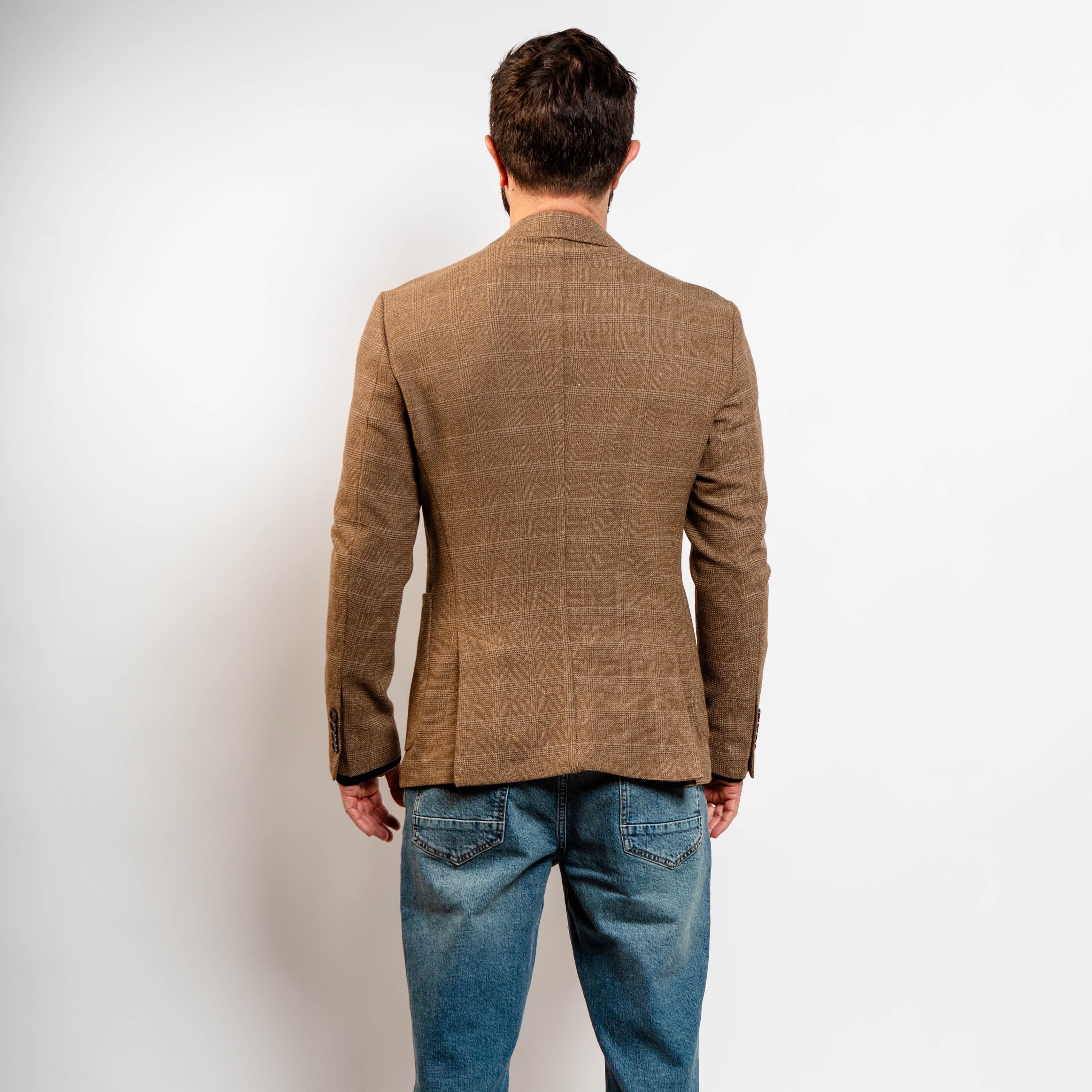 Classic camel blazer styled with jeans