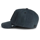 Navy blue Goorin Bros trucker hat featuring embroidered shark patch labeled SHARK on front panel
